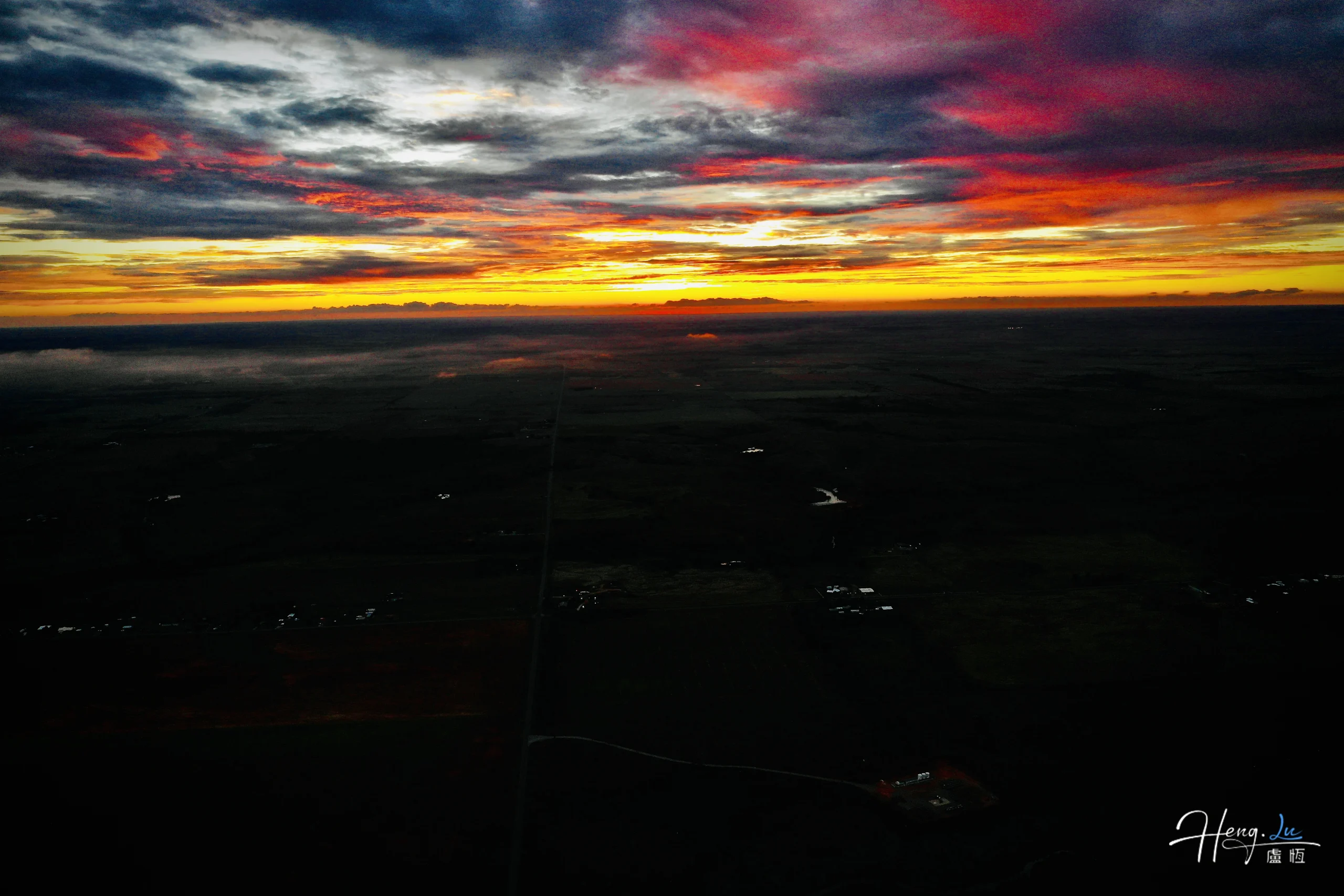 Dramatic sunset over vast fields
