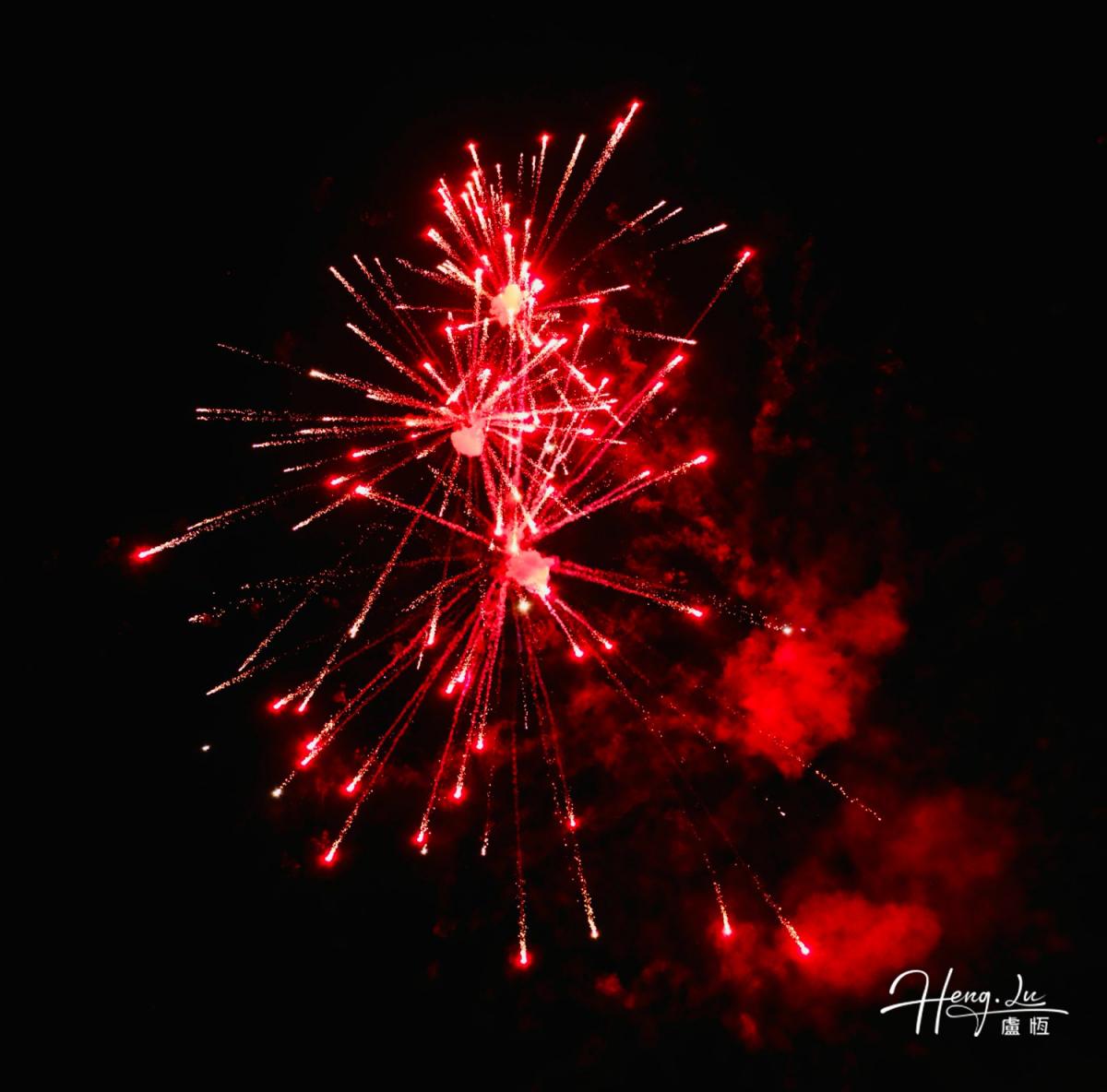 Red Firework In Dark Sky