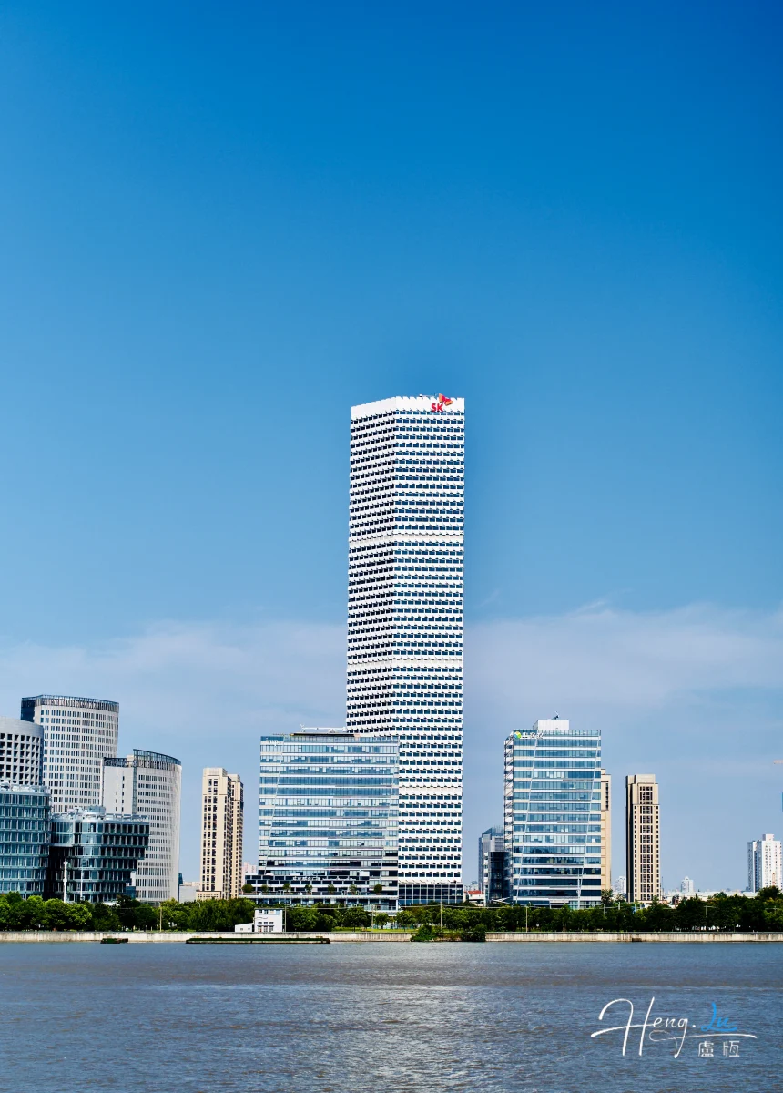modern-skyscraper-with-blue-sky-and-riverfront-view (1)
