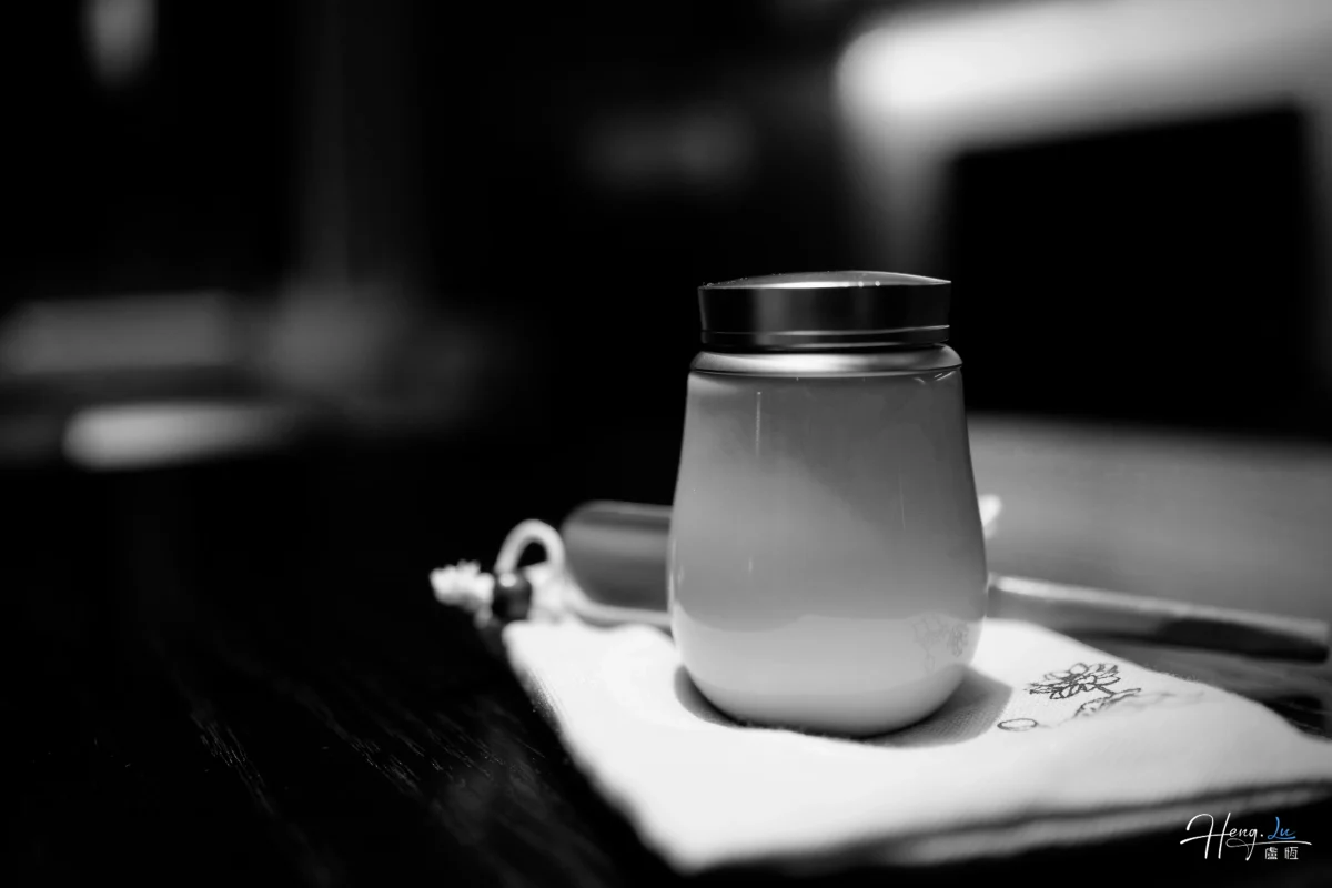 Black And White Close Up Of Ceramic Cup On Table
