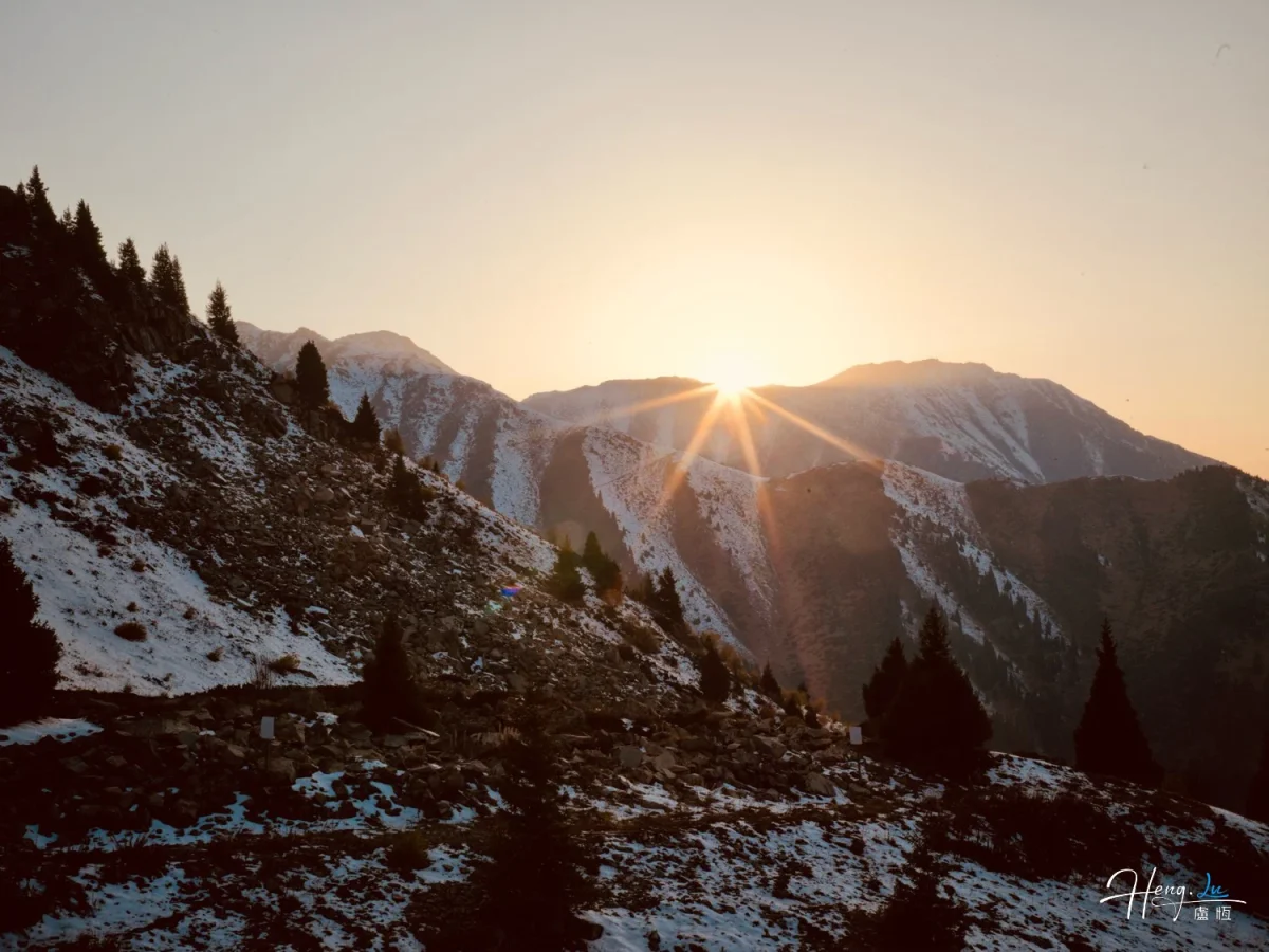 Sunrise Over Snowy Mountain Slopes With Pine Trees