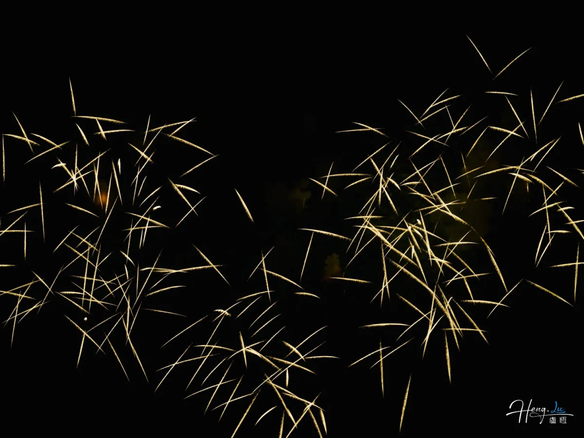 Golden Spark Trails Crisscross Beautifully Against Dark Night Sky