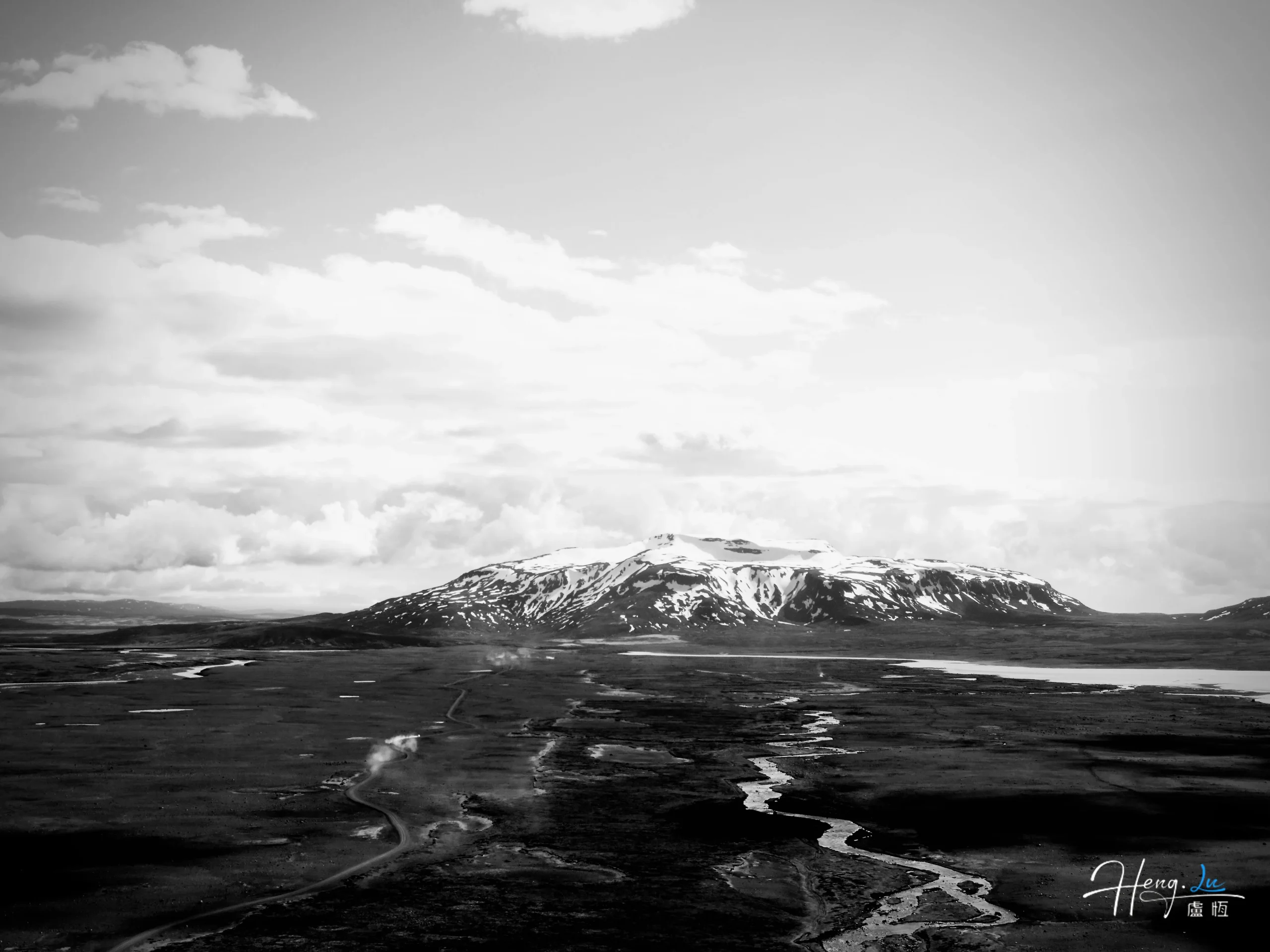 Black and white mountain landscape with river valley