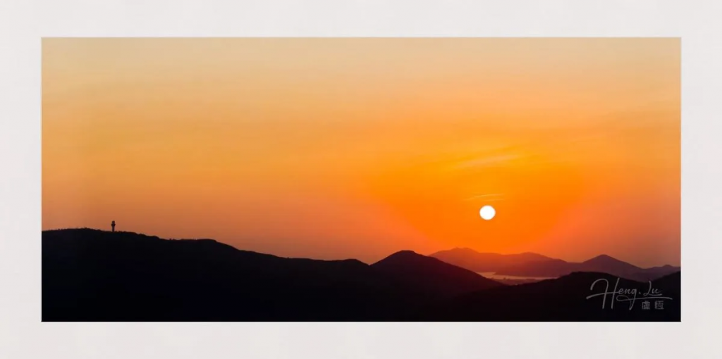 Breathtaking Sunset Over Silhouetted Hills