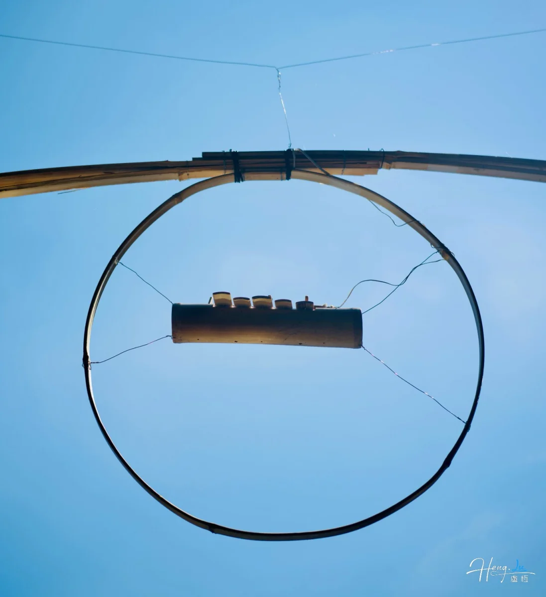 Circular Metal Frame With Hanging Device Against Clear Blue Sky
