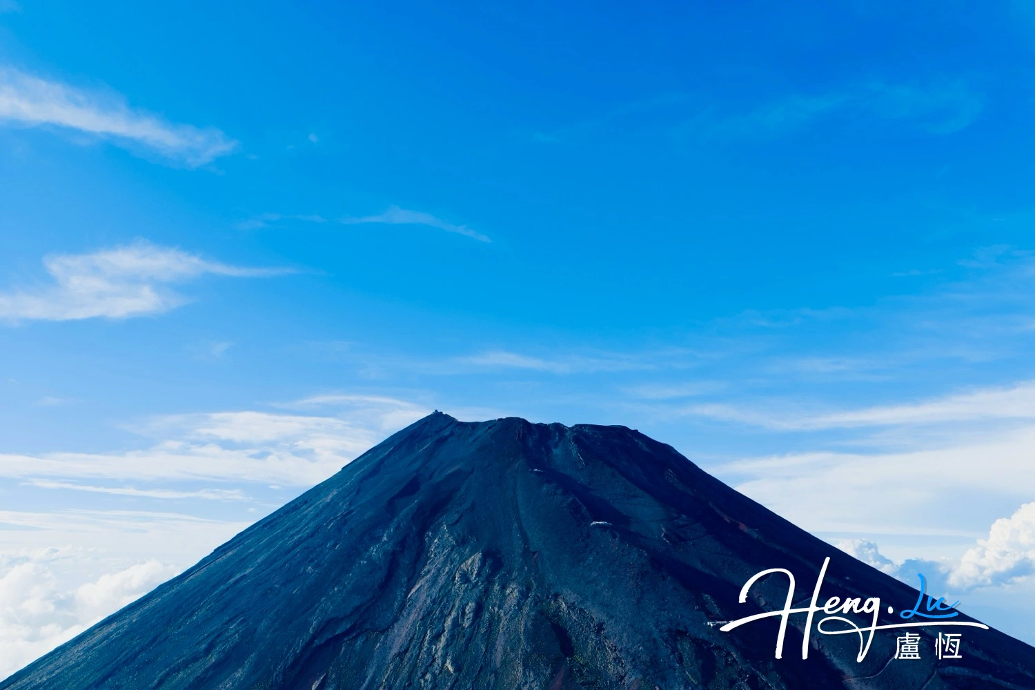 Volcanic Peak Under Blue Sky