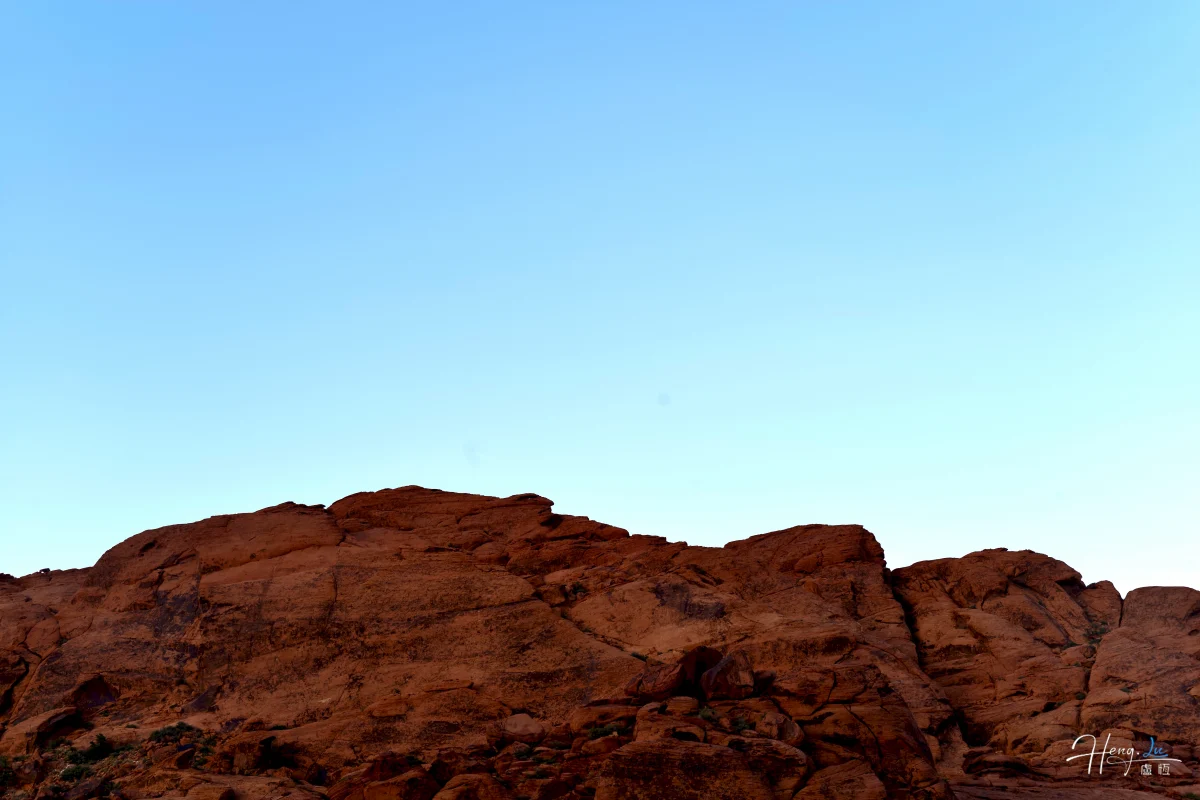 Red Sandstone Cliffs Under Clear Sky