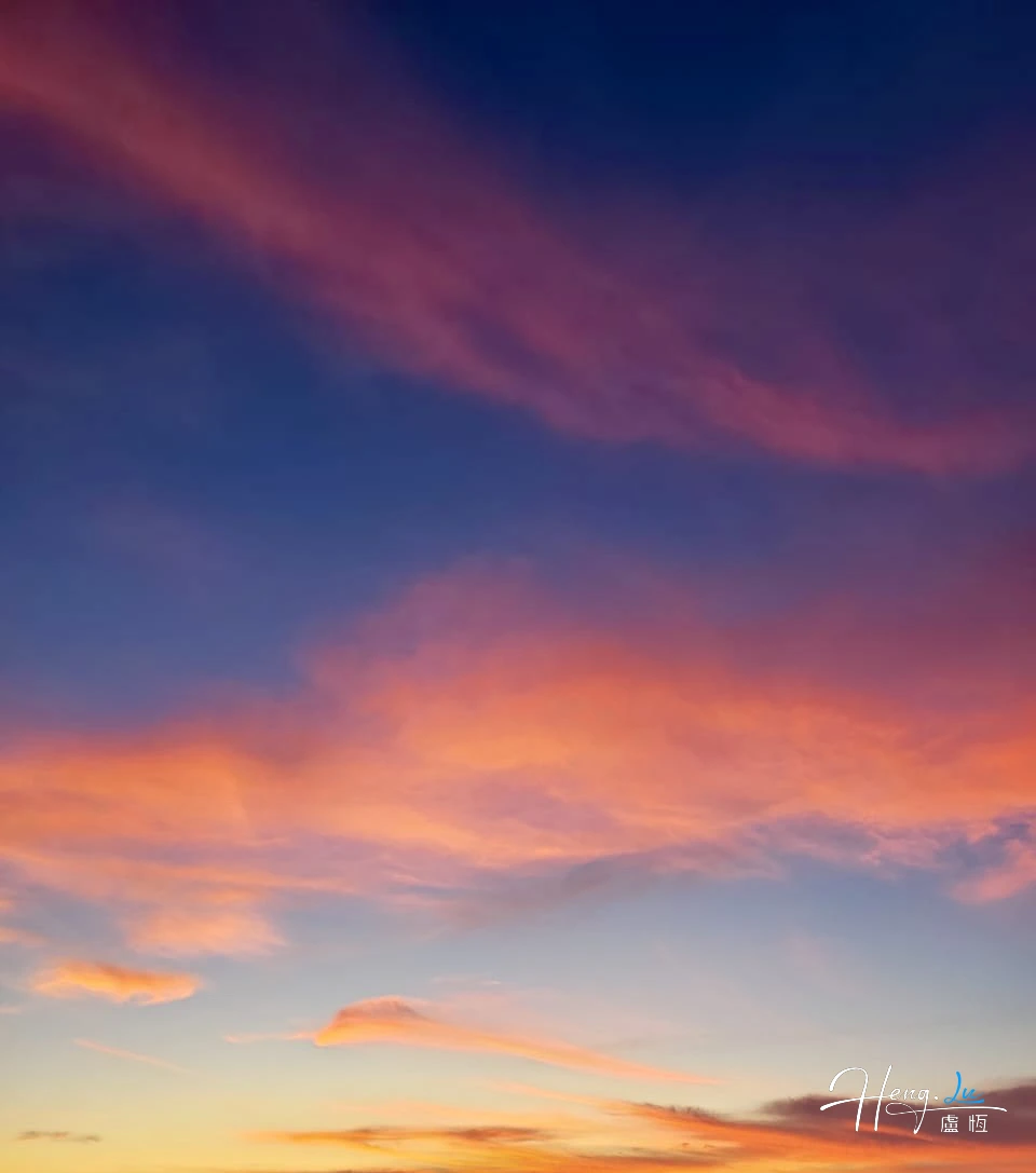 Pastel Clouds During Sunset with Soft Light Gradient in Serene Sky