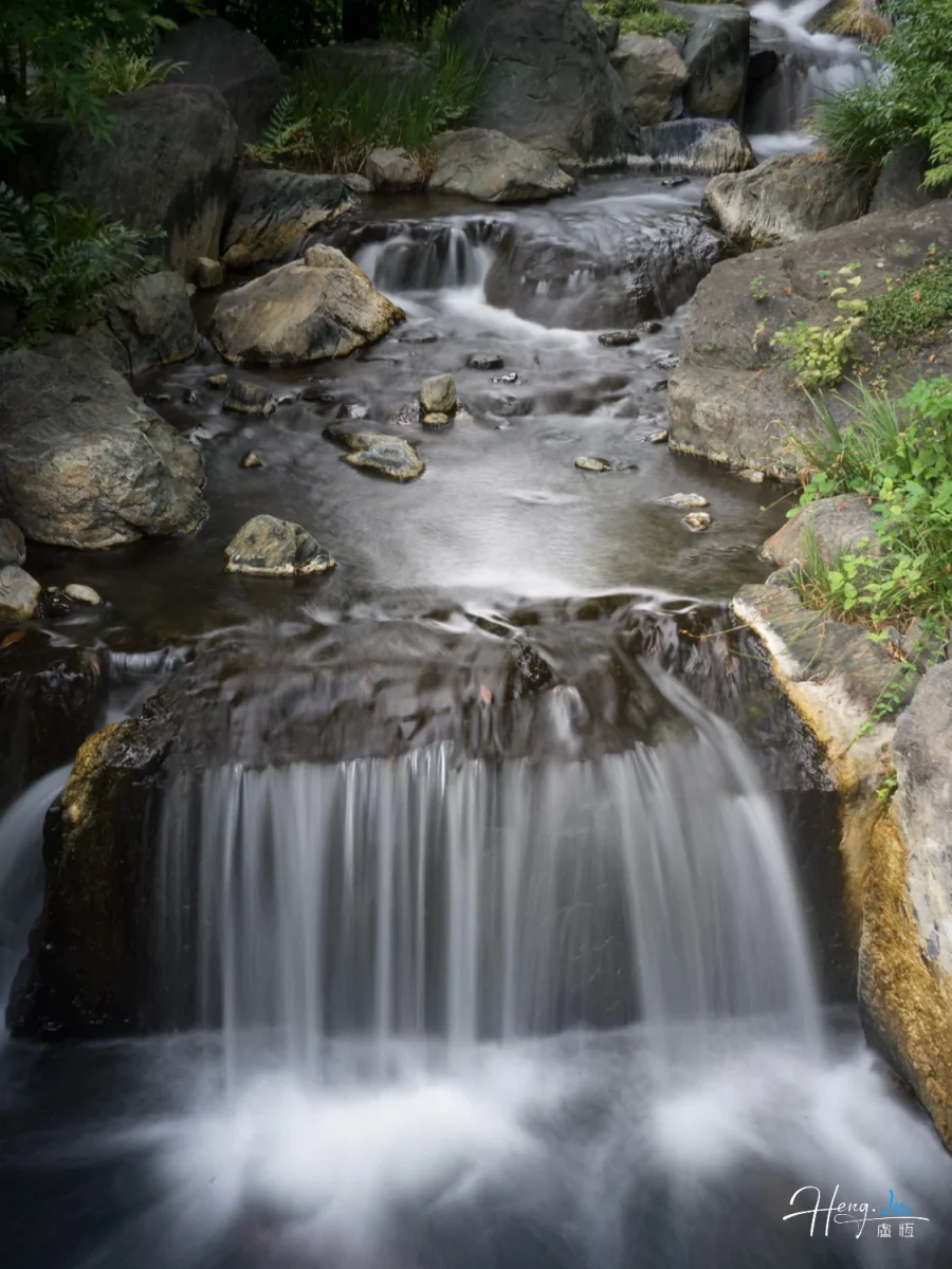 Tranquil Stream Flowing Over Rocks