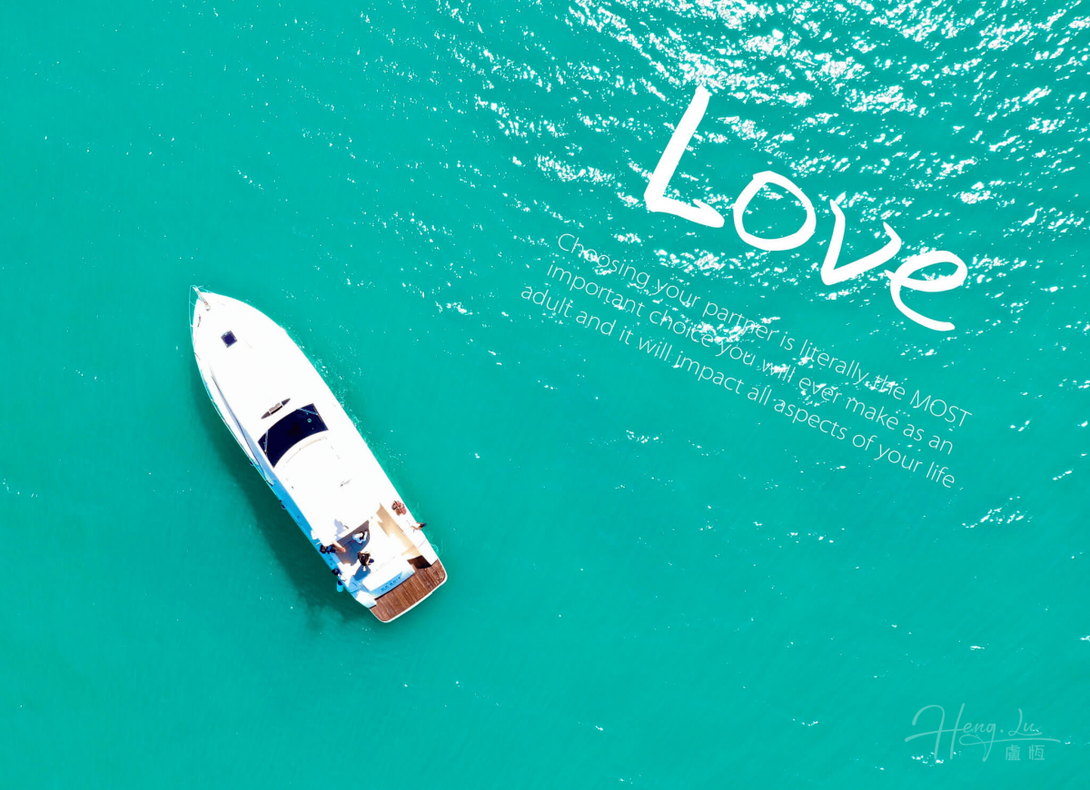 A Yacht In Turquoise Water With The Word Love