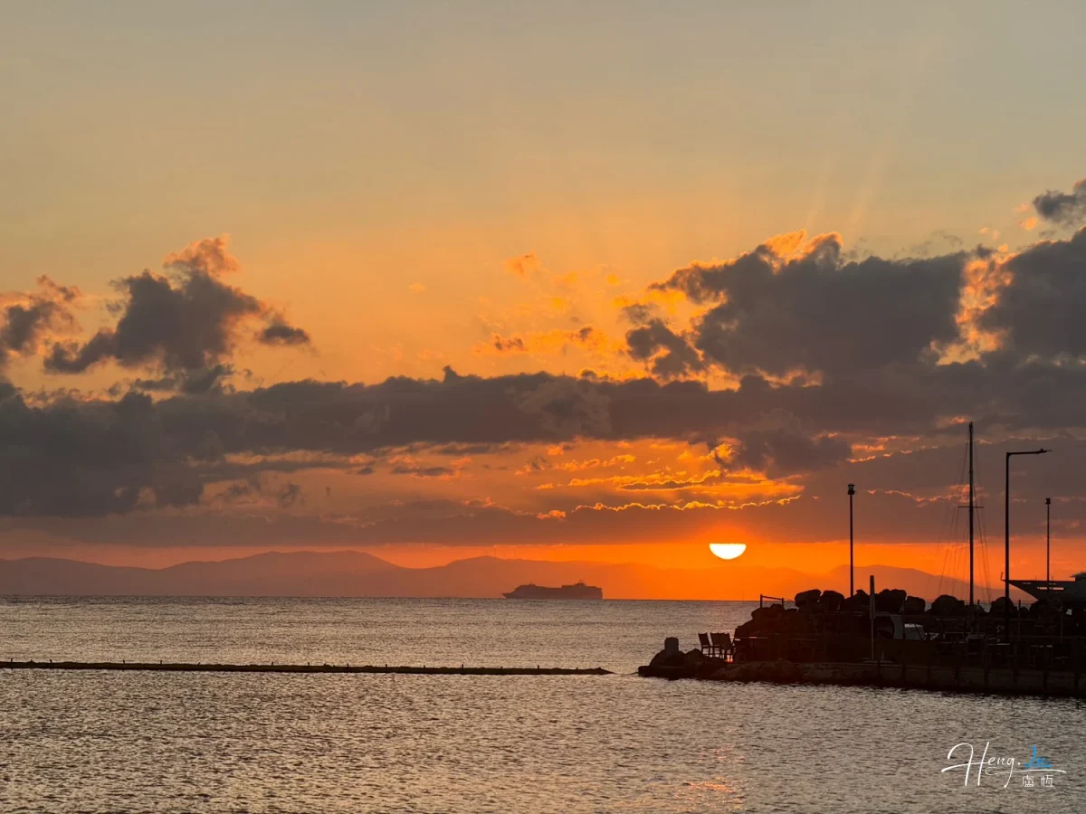 Golden Sunset Over Sea With Distant Ship