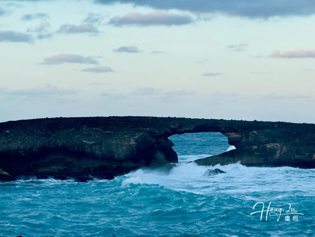 Rock Arch Over Ocean With Waves Crashing Below