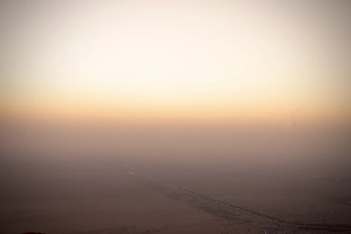 Desert Horizon Fading Into Warm Sunset Sky