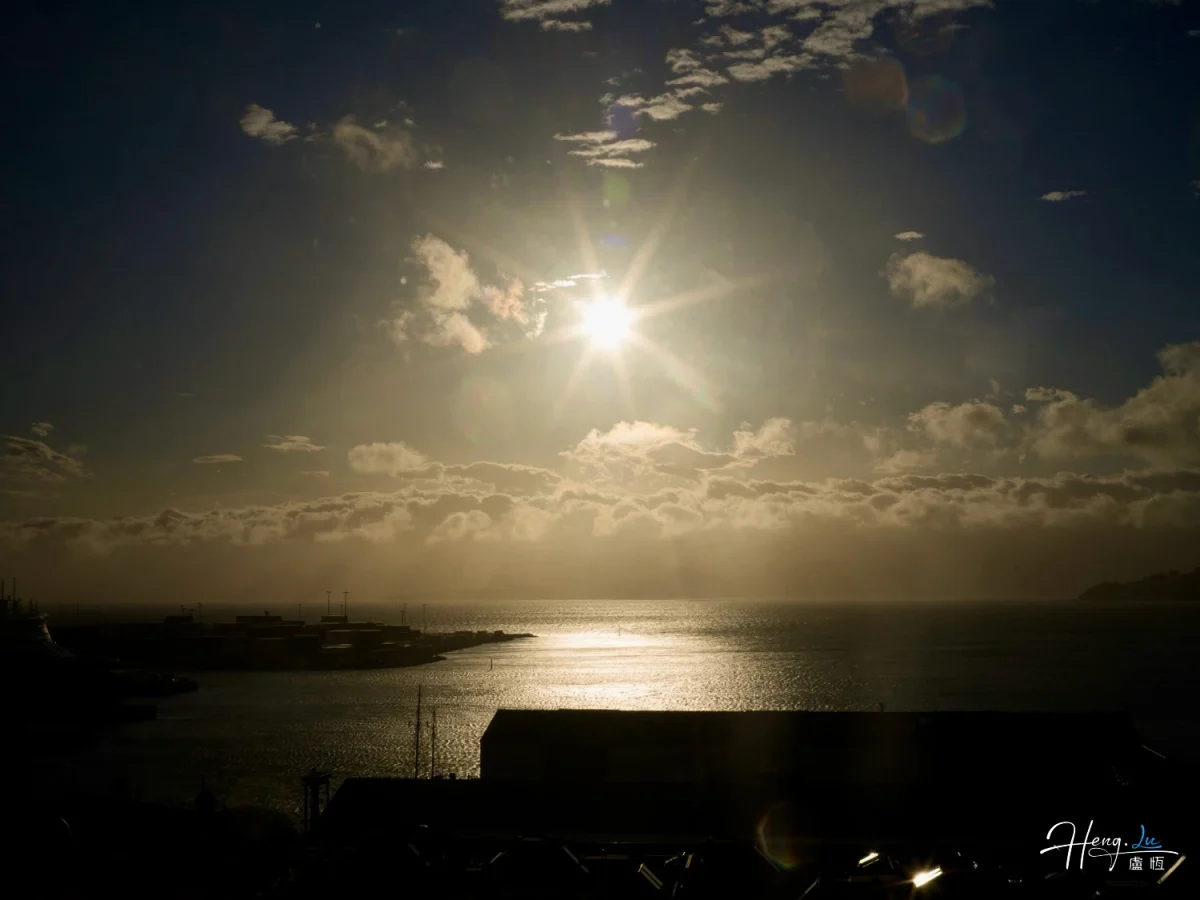 Sunlight Shining Over Sea And Harbor At Dawn