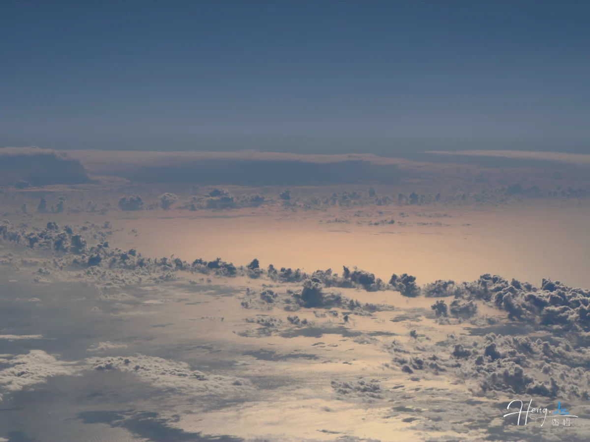 aerial-view-of-clouds-above-sunlit-ocean (1)