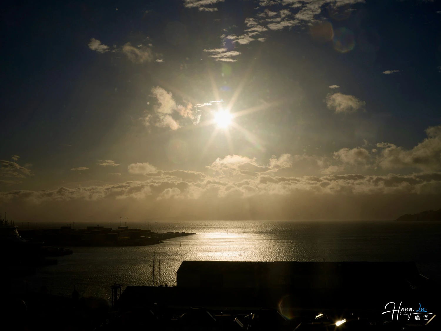 Sunlight Shining Over Sea and Harbor at Dawn
