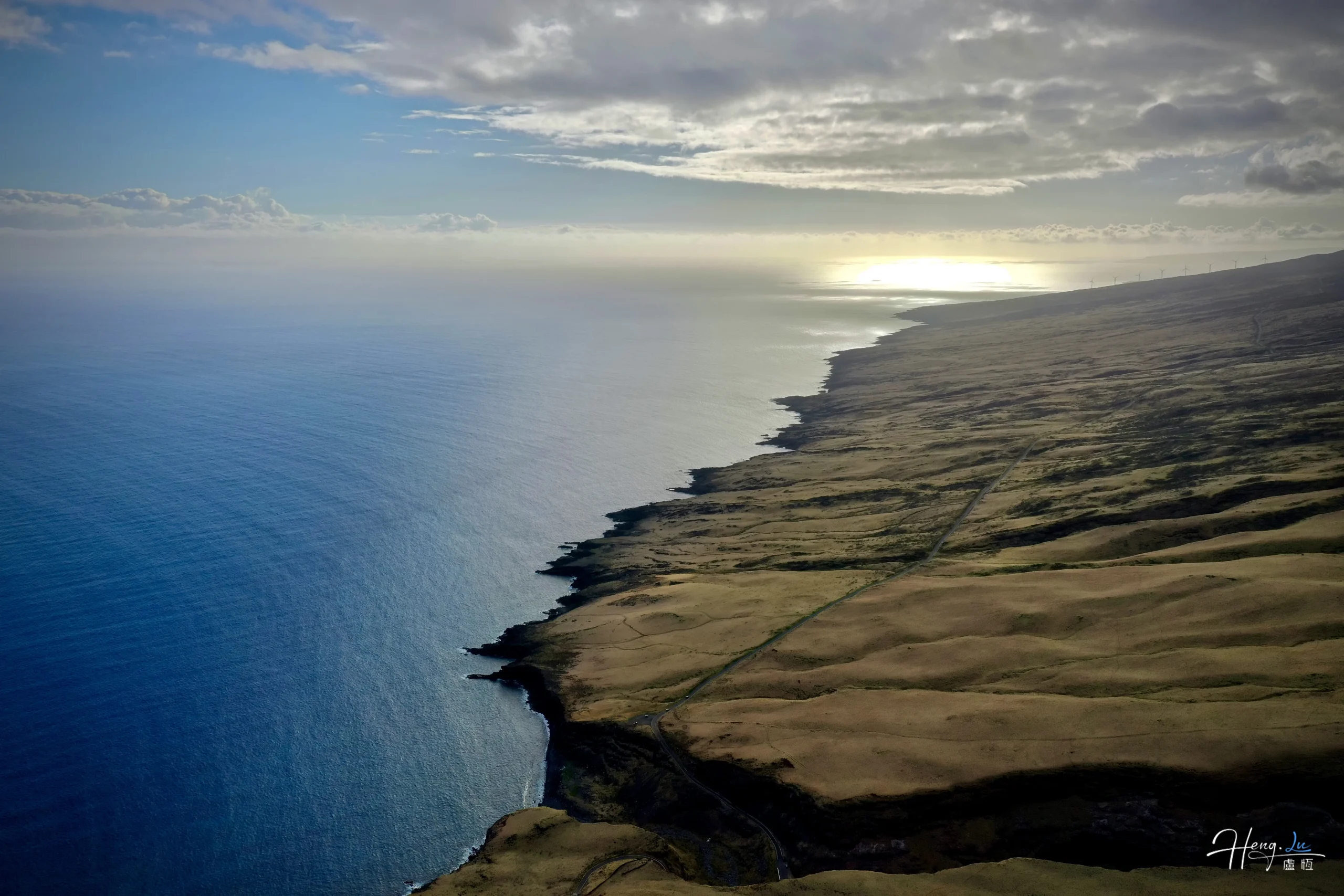 Aerial view of coastal cliffs under soft sunlight