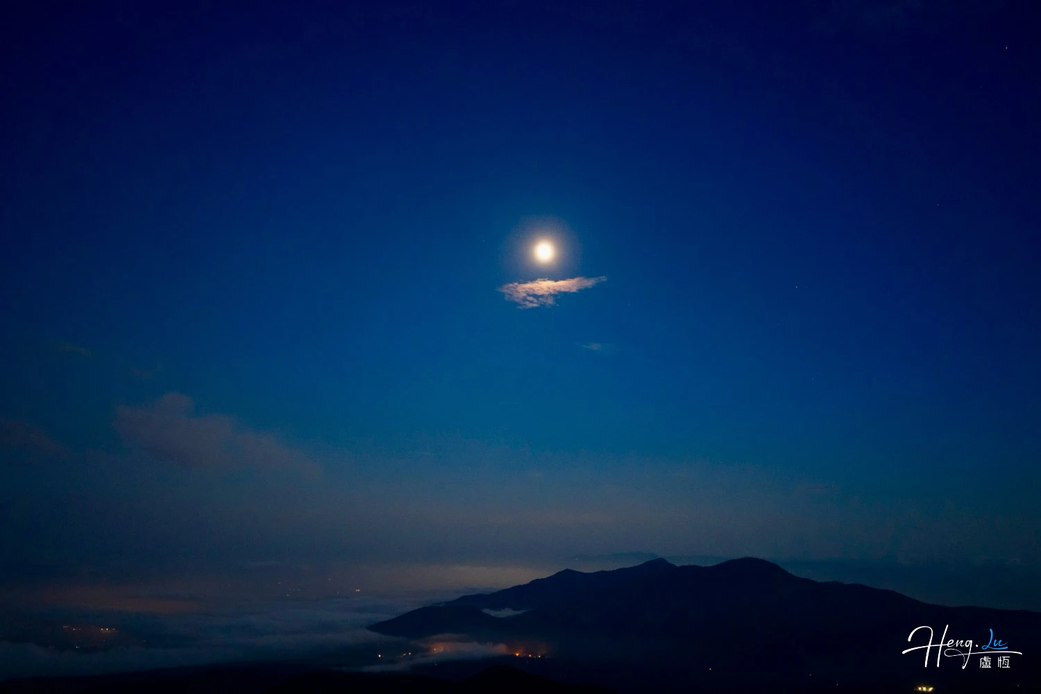 Bright Moon Above Mountains and Night Haze