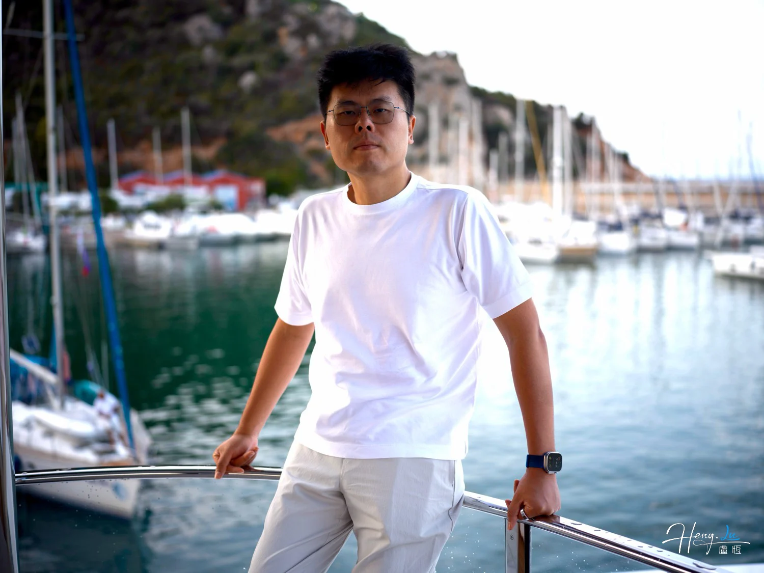 Luheng standing on yacht with marina background
