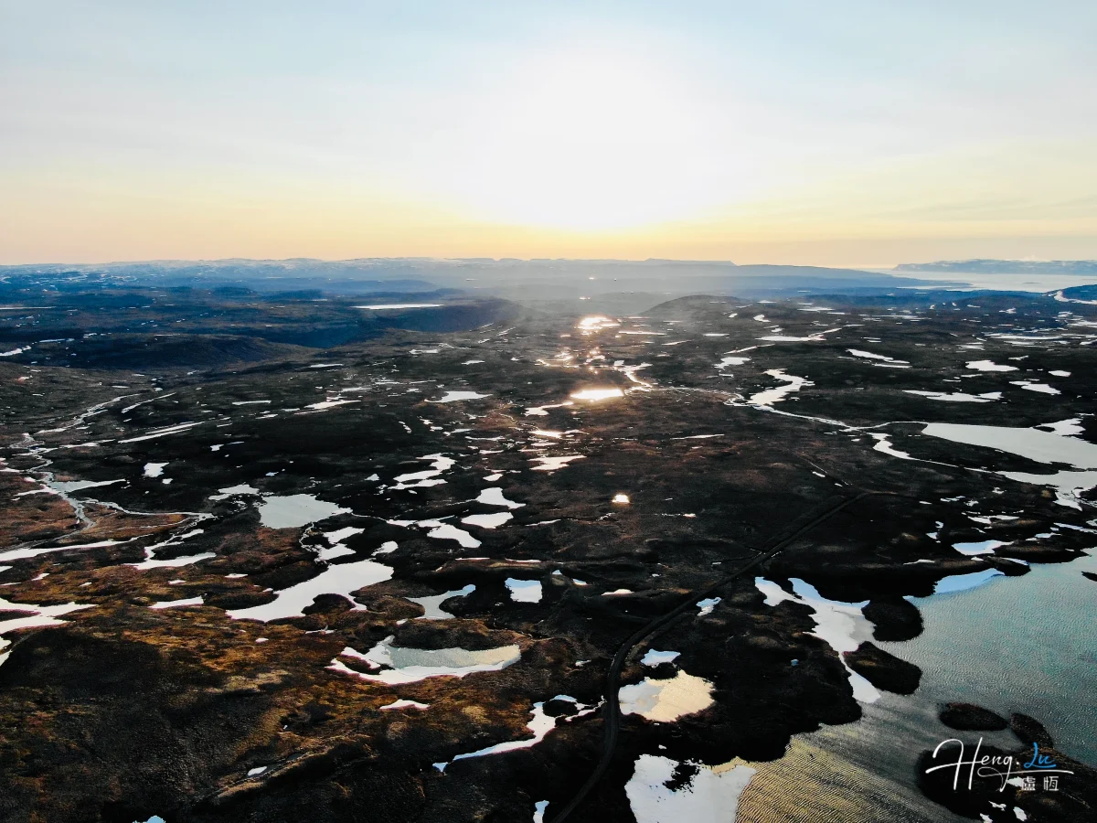 Sunset Over Frozen Lakes And Mountains