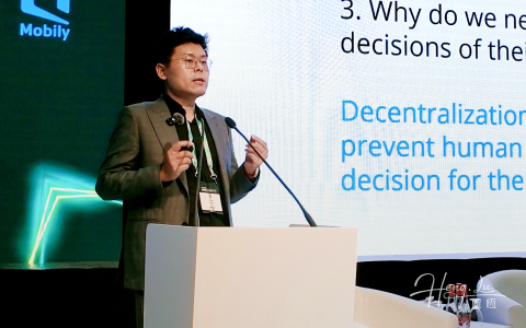 Lu Heng speaking on stage at Capacity Middle East in Dubai.