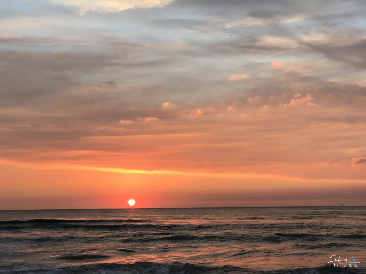 Orange Sunset Over Peaceful Ocean Waves