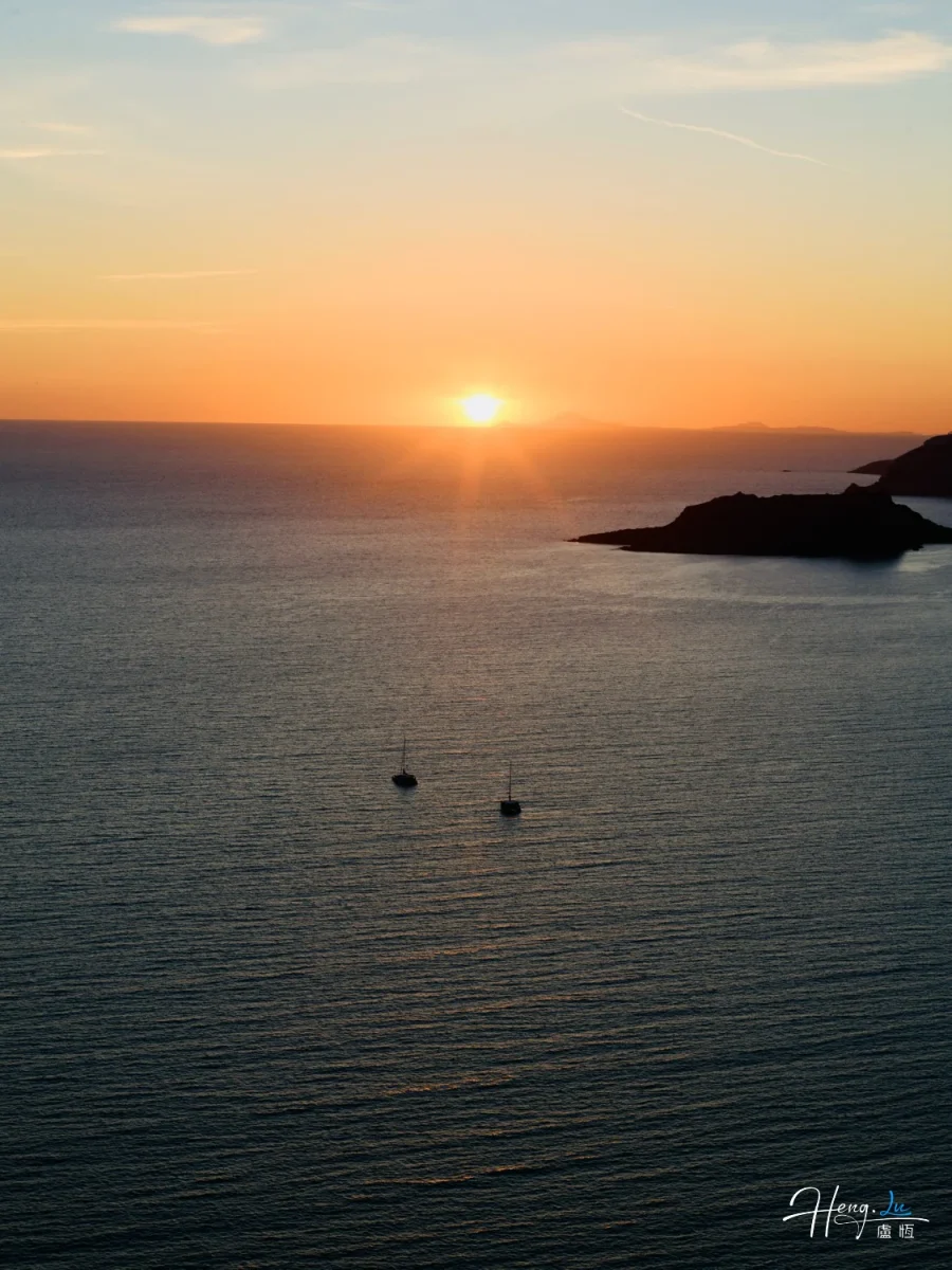 Sunset Over Calm Sea With Boats