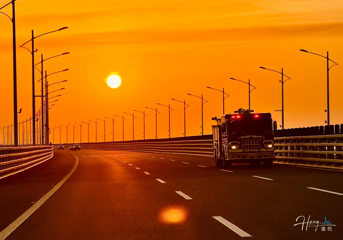 firetruck-driving-on-bridge-at-sunset (1) (1)