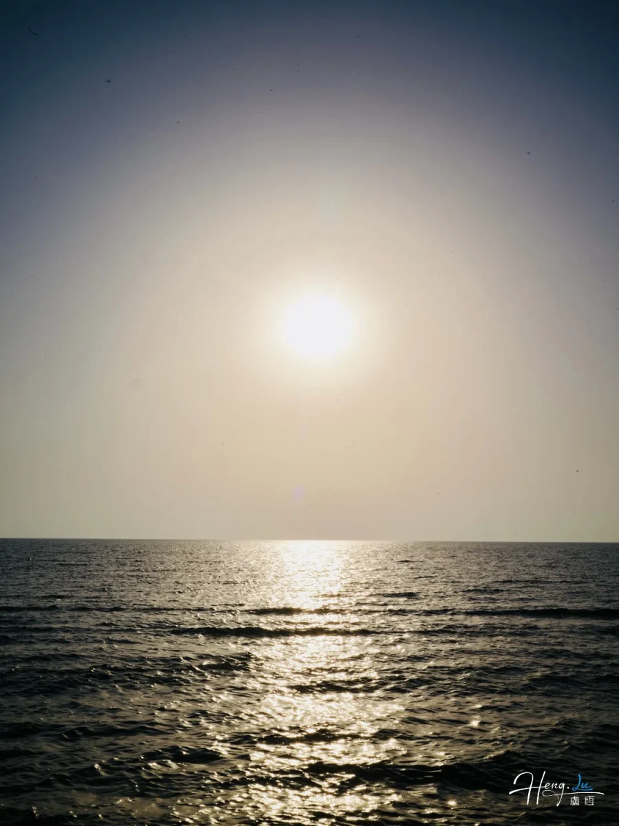 Bright Sun Reflecting On Calm Sea Horizon