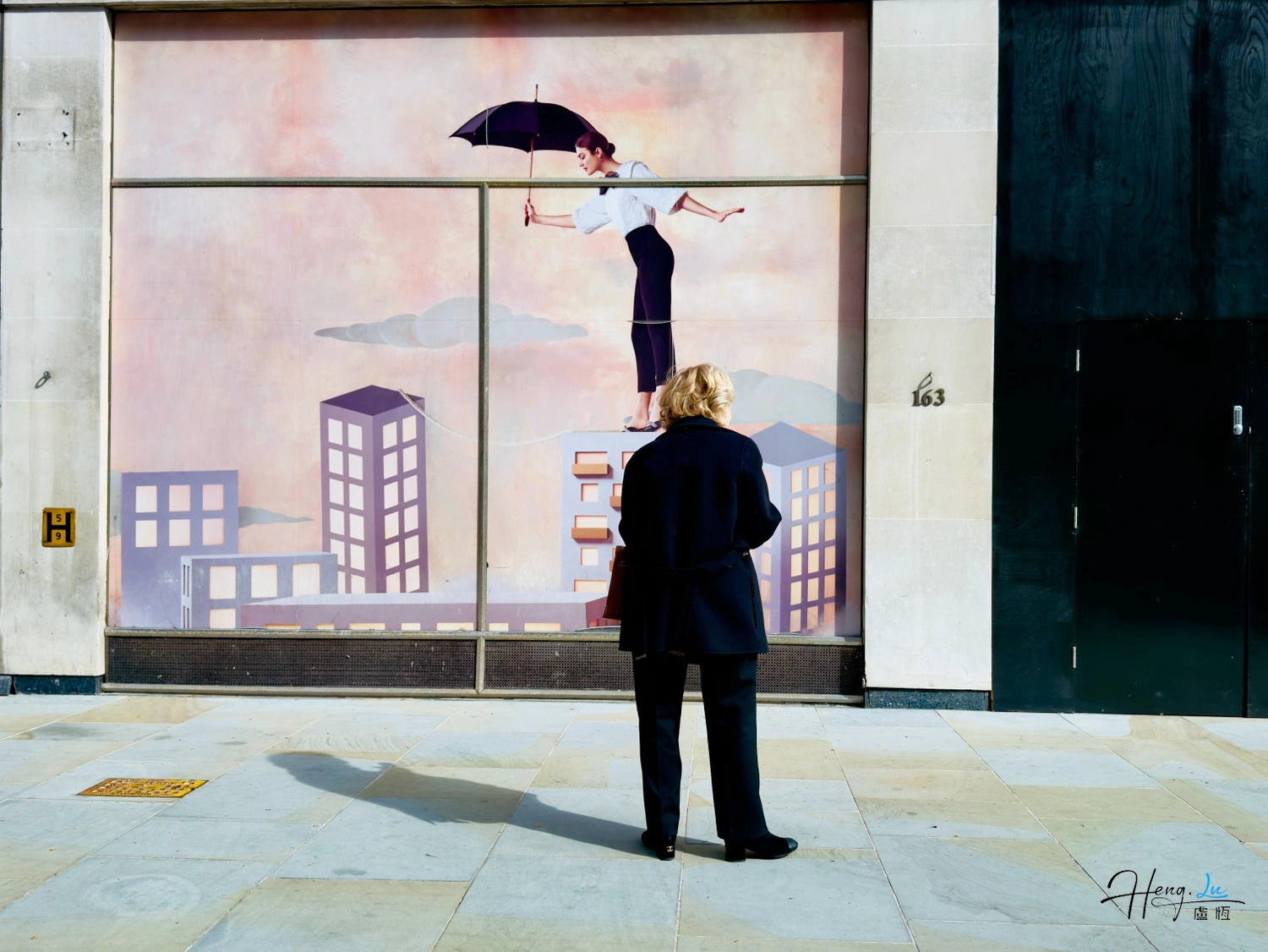 Woman looking at tightrope walker window art