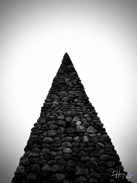 Black and white stone pyramid structure