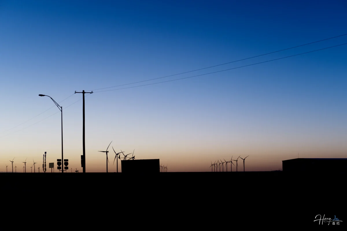 Wind Turbines Under Clear Twilight Sky
