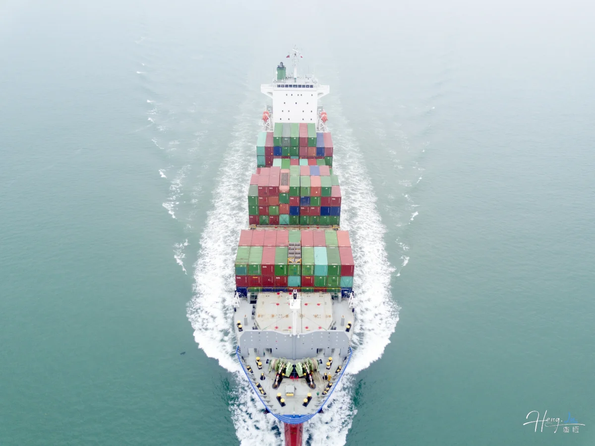 Cargo Ship Sailing Across Calm Sea
