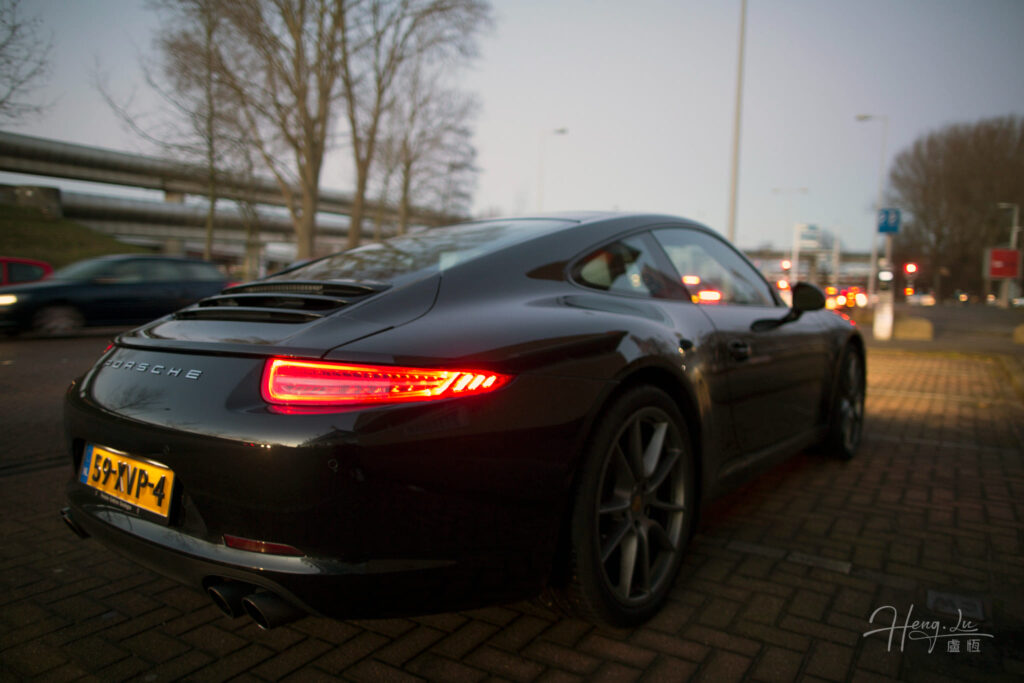 Black Porsche 911 with Glowing Tail Lights