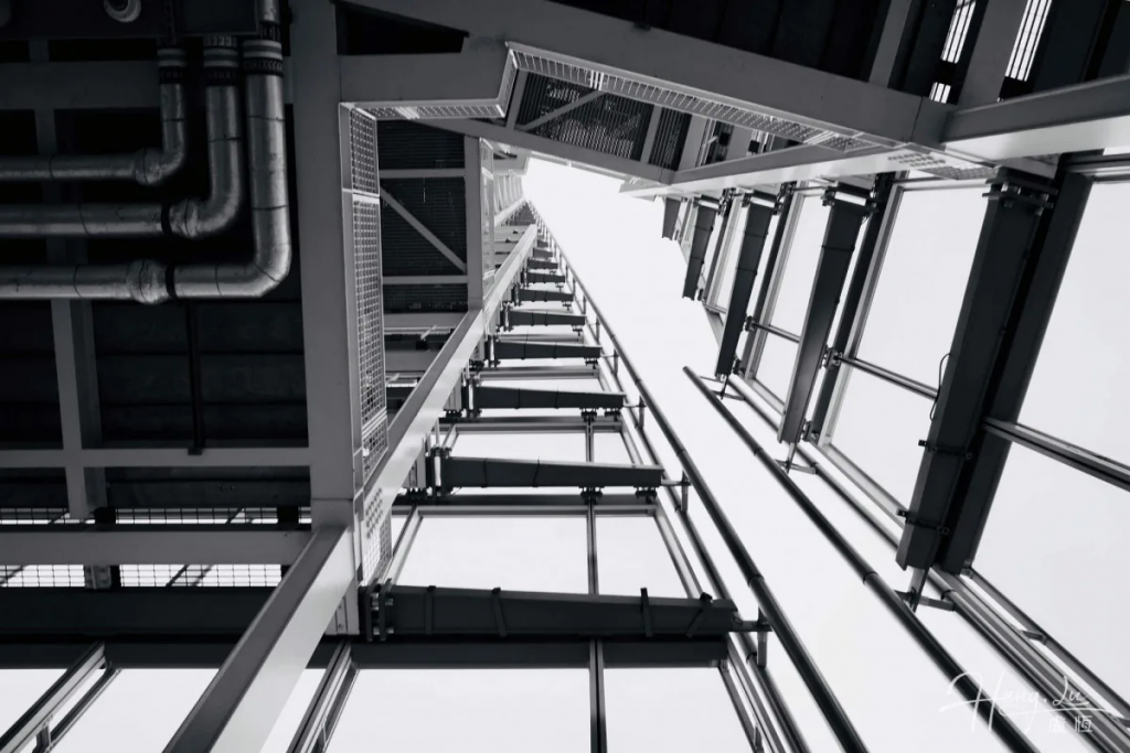 Geometric lines of building rising into empty sky