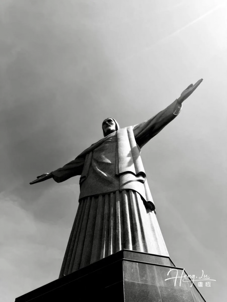 Monumental Christ statue captured in black and white