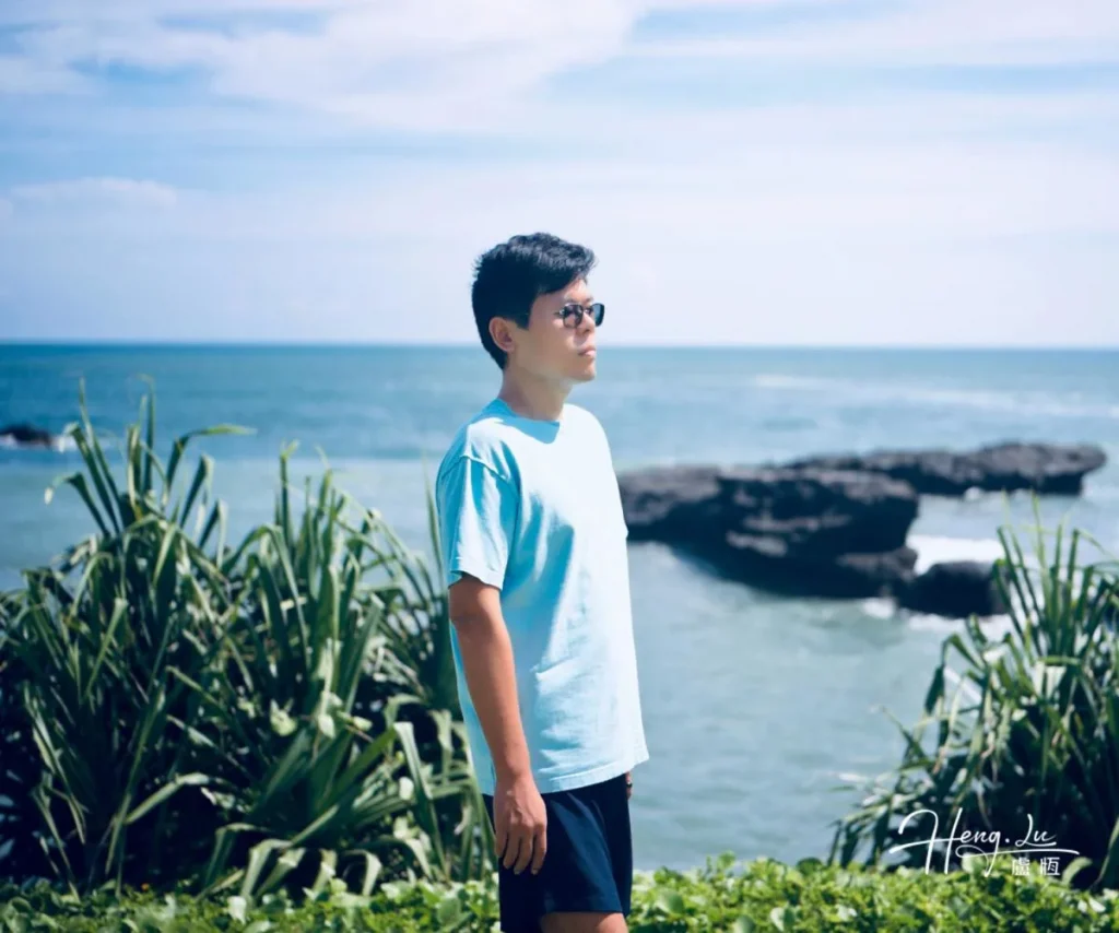 Luheng in Blue Tee at Ocean Rocks Luheng-in-blue-tee-standing-by-ocean-rocks