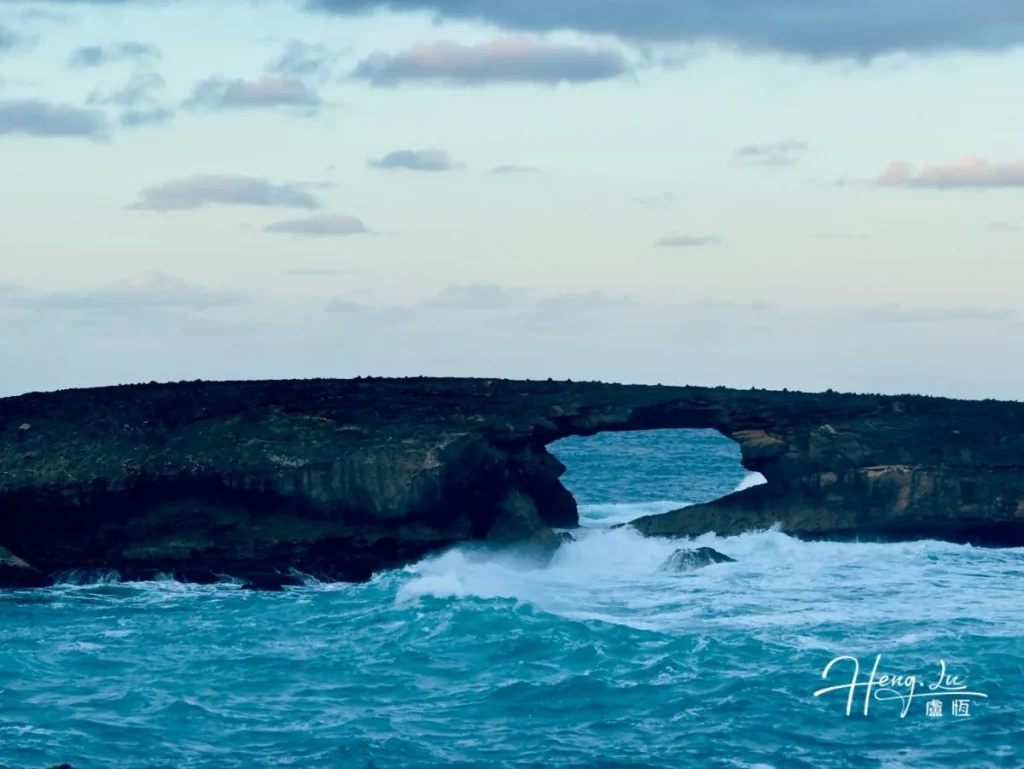 Stunning Coastal Rock Arch with Turquoise Waves Rock-arch-over-ocean-with-waves-crashing-below