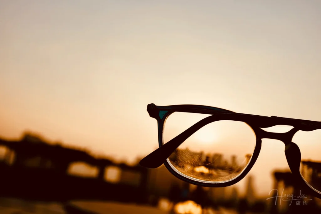 A-pair-of-eyeglasses-reflecting-a-sunset