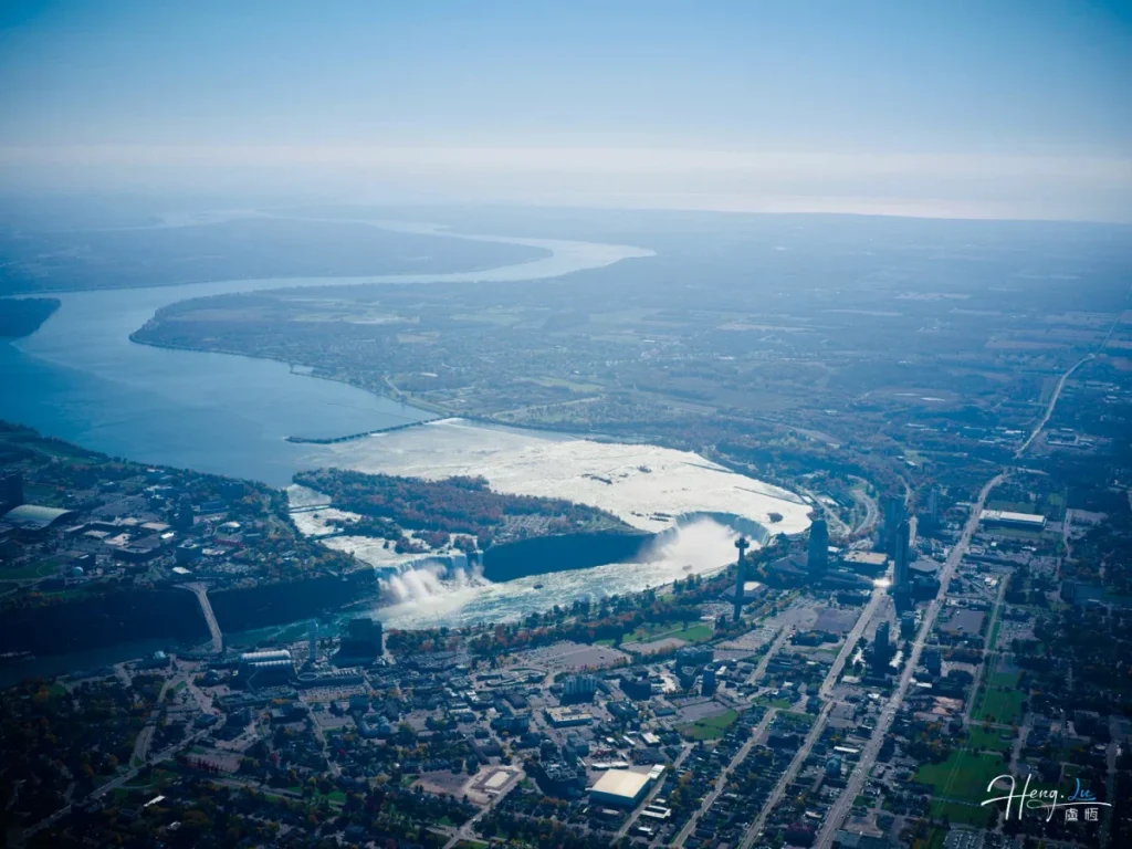 River bending through the edge of the city Aerial-view-of-city-and-river-landscape