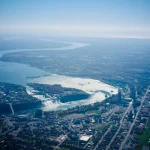 River bending through the edge of the city Aerial-view-of-city-and-river-landscape