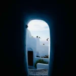 Blue Tunnel Leading to White Buildings in Coastal Village Blue-tunnel-leading-to-white-buildings
