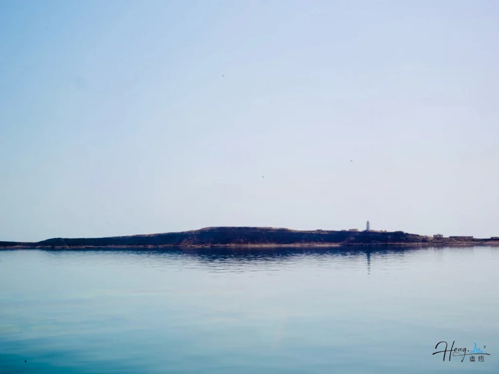 Calm Seascape with a Distant Lighthouse Calm-seascape-with-distant-lighthouse