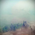 Cityscape-covered-in-morning-mist-from-above
