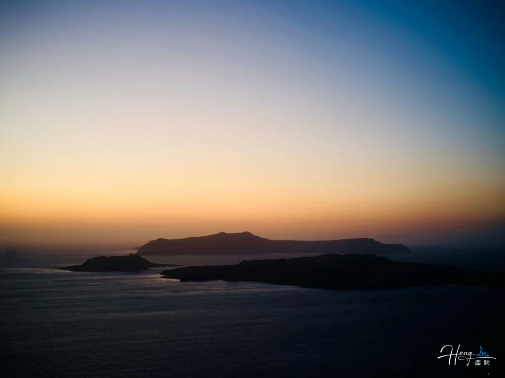 Islands fading beneath a painted sky Evening-haze-over-sea-and-islands