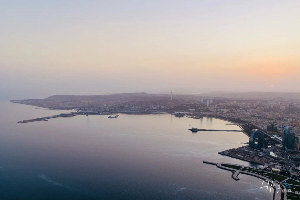 Dawn Stillness Over the Caspian City Golden-horizon-over-serene-coastal-city