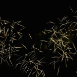 Golden-spark-trails-crisscross-beautifully-against-dark-night-sky