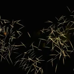 Golden-spark-trails-crisscross-beautifully-against-dark-night-sky