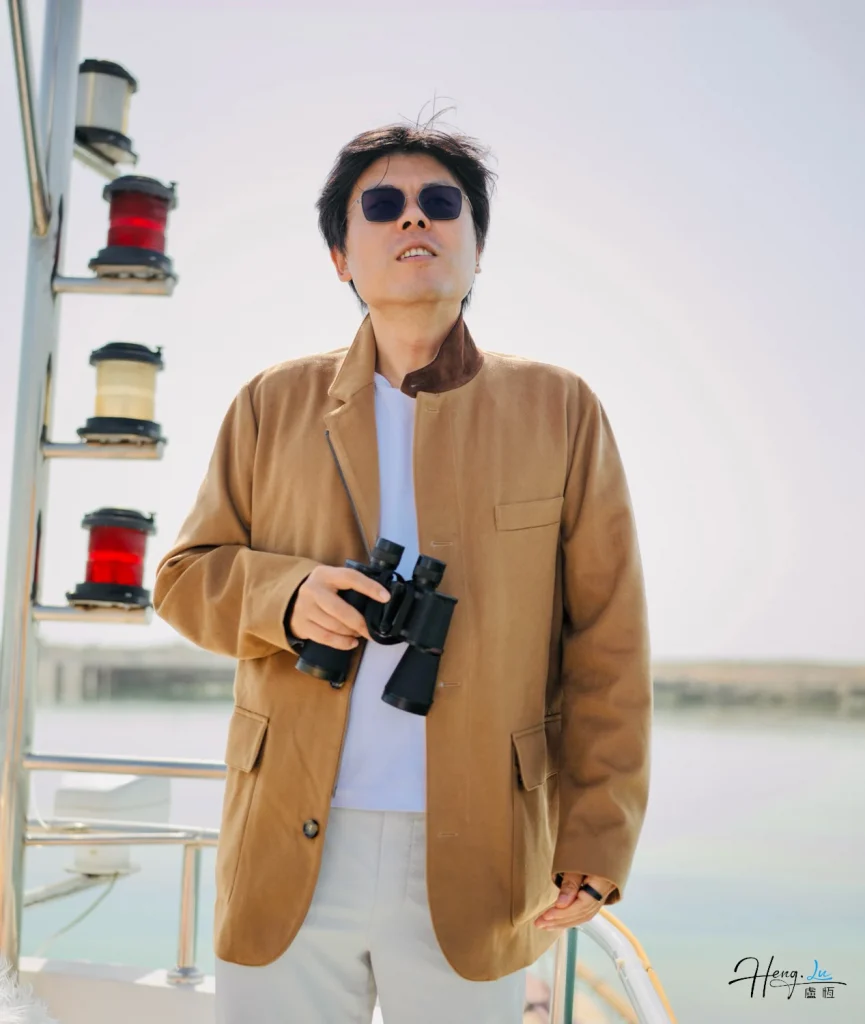 Morning glare on the aft deck Luheng-holding-binoculars-on-boat-deck