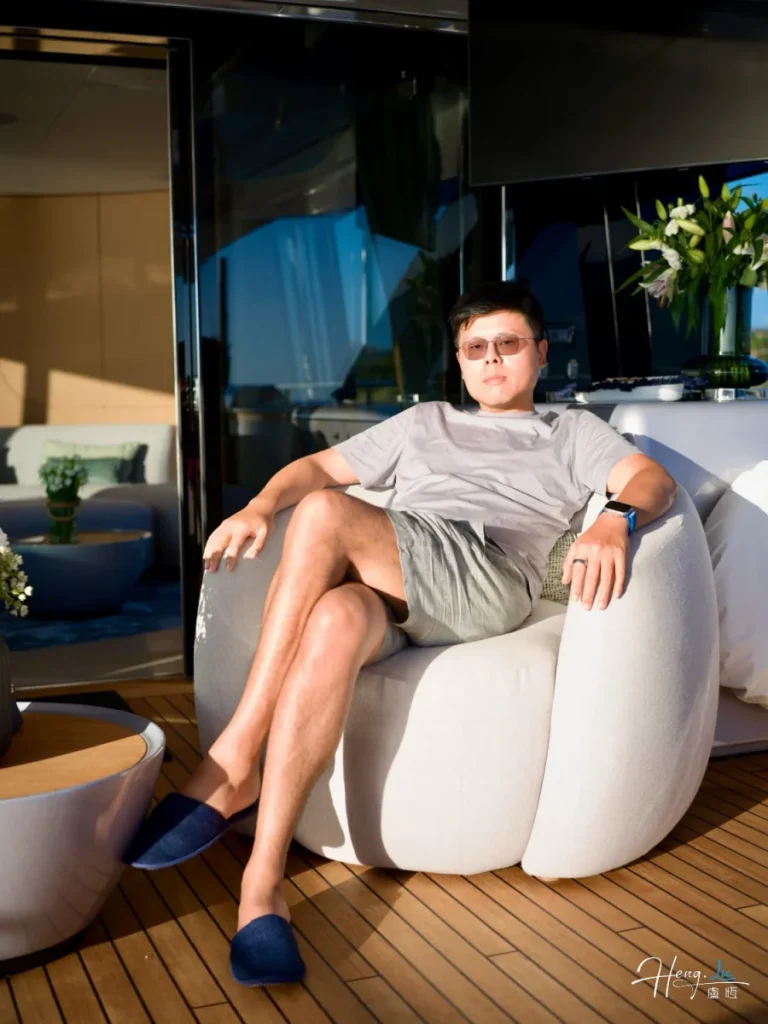 Lu Heng in quiet reflection Luheng-sitting-outdoors-in-sunlight